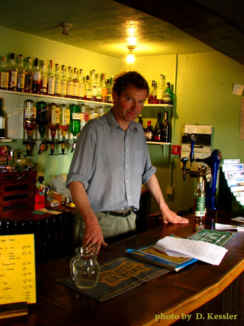 Mike, behind the bar of the Crask